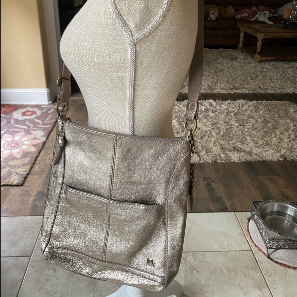 SAK Platinum silver cross body purse.